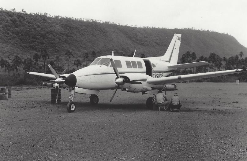 A small airplane parked on a runway